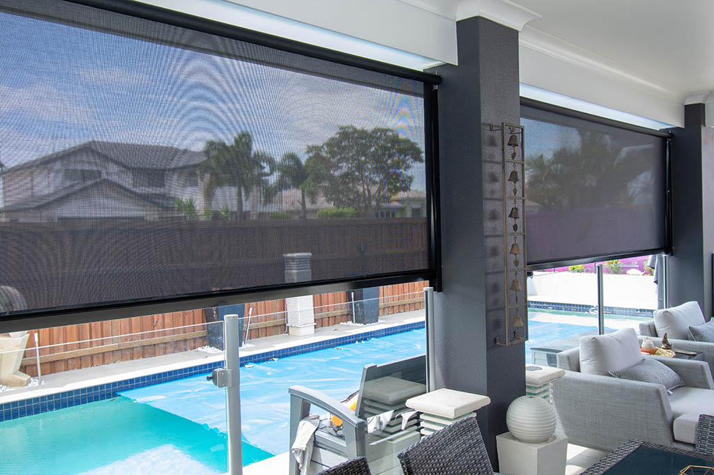 Outdoor blinds overlooking swimming pool