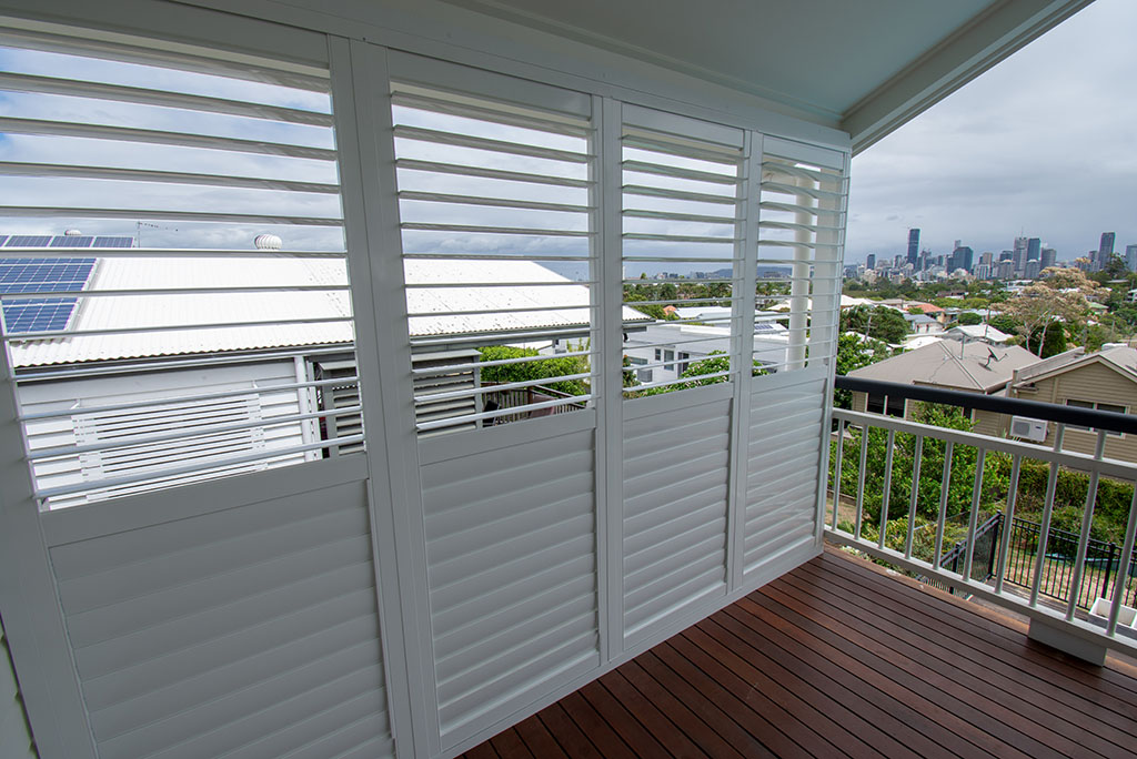 Deck overlooking the city with new plantation shutters | Featured image for the Shutters Brisbane Top Level Page on Shutters Blinds & Awnings
