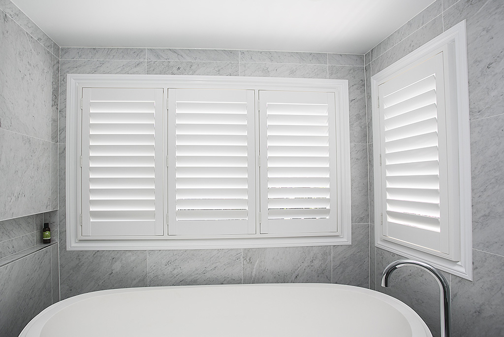 Sleek bath with new plantation shutters above it |Featured image for the Shutters Brisbane Top Level Page on Shutters Blinds & Awnings.