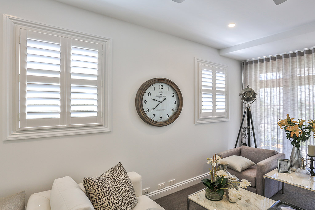 Sylish living room with new plantation shutters |Featured image for the Shutters Brisbane Top Level Page on Shutters Blinds & Awnings.