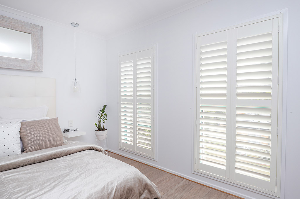 Bedroom with new white plantation shutters | Featured image for the Shutters Brisbane Top Level Page on Shutters Blinds & Awnings.