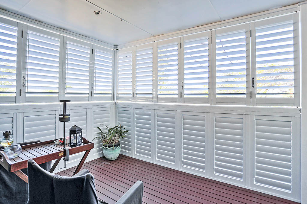 Outdoor deck area with new white plantation shutters | Featured image for the Shutters Brisbane Top Level Page on Shutters Blinds & Awnings