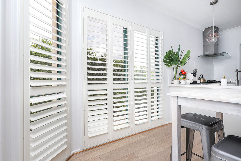Sylish kitchen room with new plantation shutters | Featured image for the Shutters Brisbane Top Level Page on Shutters Blinds & Awnings.
