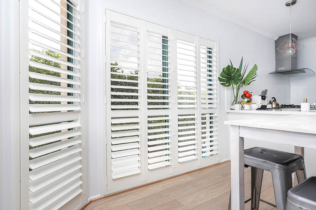 Modern kitchen with new plantation shutters | Featured image for the Blinds Shutters and Awnings Home Page on Shutters Blinds & Awnings