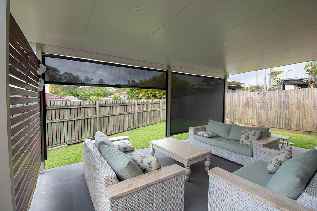 Outdoor blinds surrounding an alfresco seating area | Featured image for the Outdoor Blinds Brisbane Page on Shutters Blinds & Awnings.