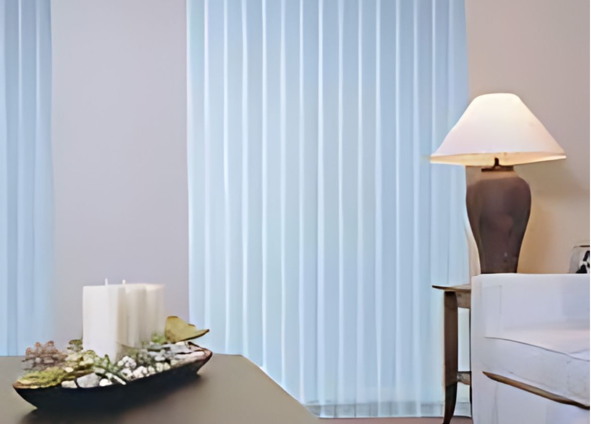 Vertical Blinds next to lamp | Featured image for the Vertical Blinds Brisbane Page on Shutters Blinds & Awnings.